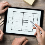 Architect working on digital tablet